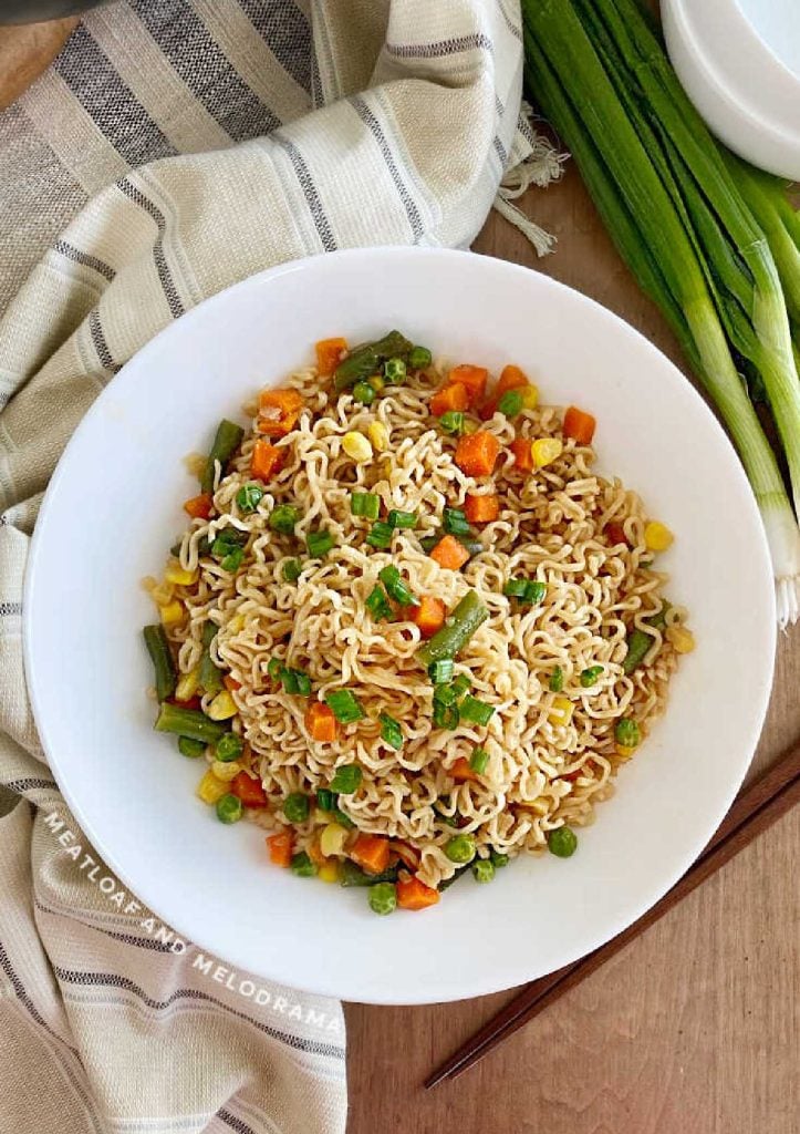 bowl of soy sauce ramen noodles and vegetables on the table