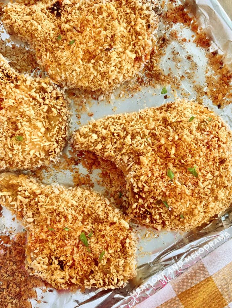 crispy panko breaded pork chops baked in oven on baking sheet