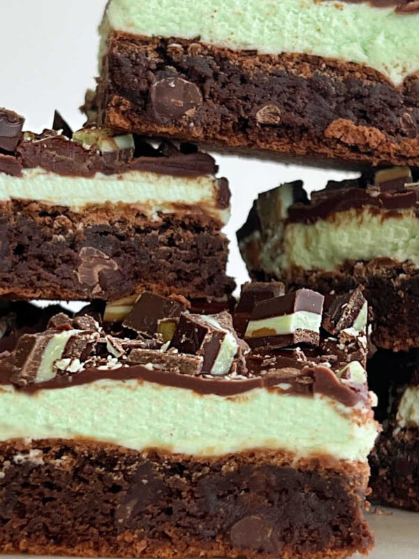 mint chocolate chip brownies with mint frosting and chocolate ganache stacked