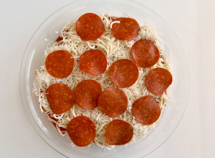 unbaked pepperoni dip in a pie plate