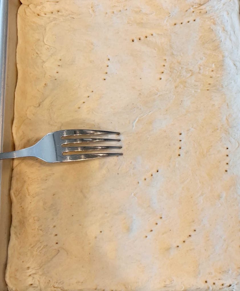 poke holes in pizza crust with fork