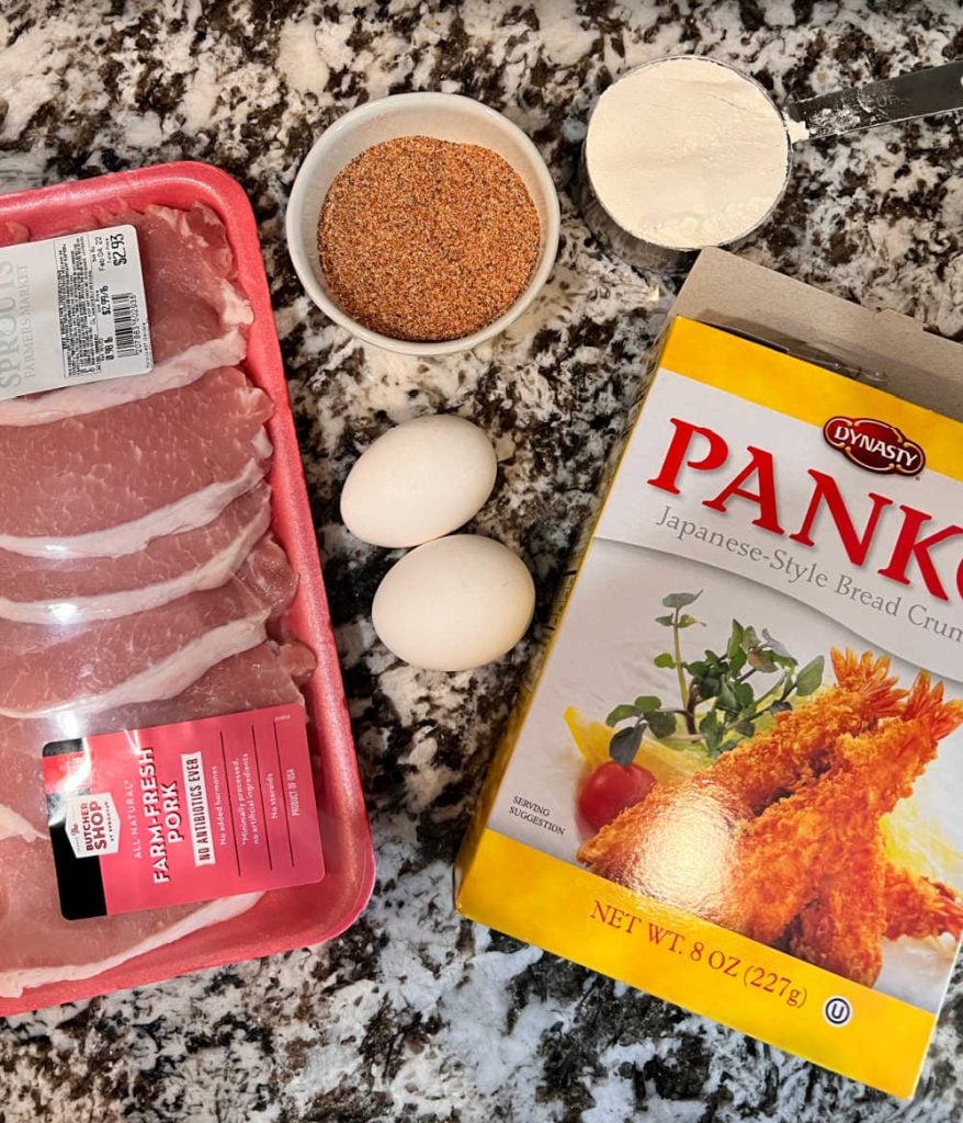 boneless pork cutlets, eggs. spices, flour and panko bread crumbs on the counter
