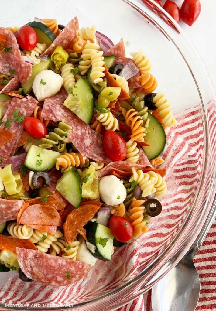 Itallian pasta salad with pepperoni and fresh vegetables in bowl