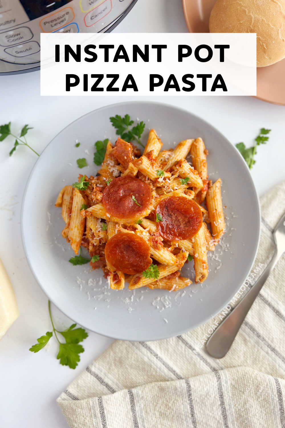 Instant Pot Pizza Pasta is an easy recipe made with penne pasta, sausage, pepperoni and your favorite pizza toppings. Ready in 30 minutes! Your whole family will love this kid friendly dinner! via @meamel