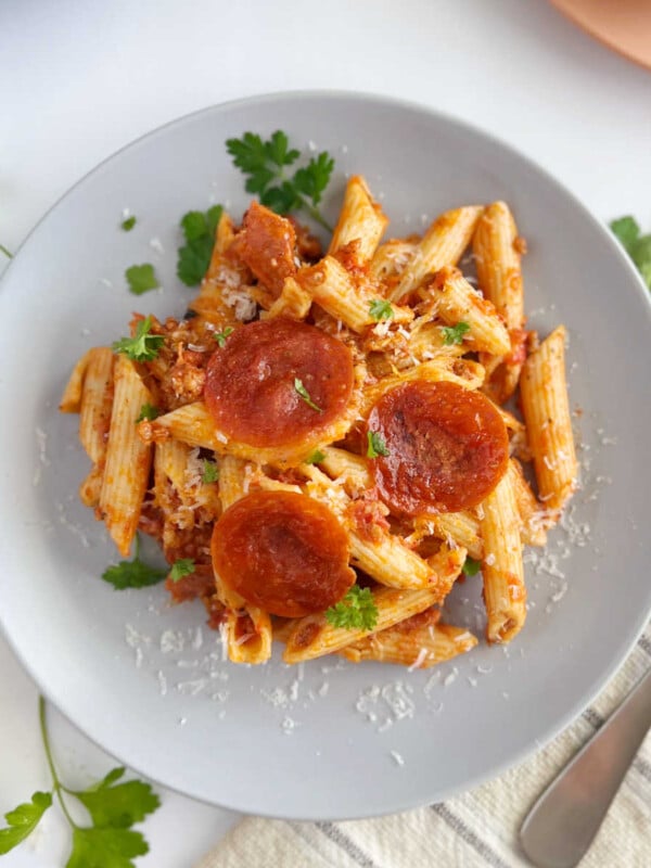 instant pot pizza pasta with pepperoni slices on a plate