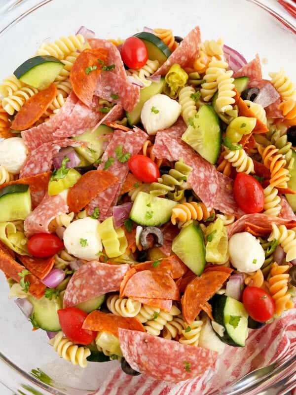 Italian pasta salad with pepperoni, rotini pasta and fresh vegetables in bowl