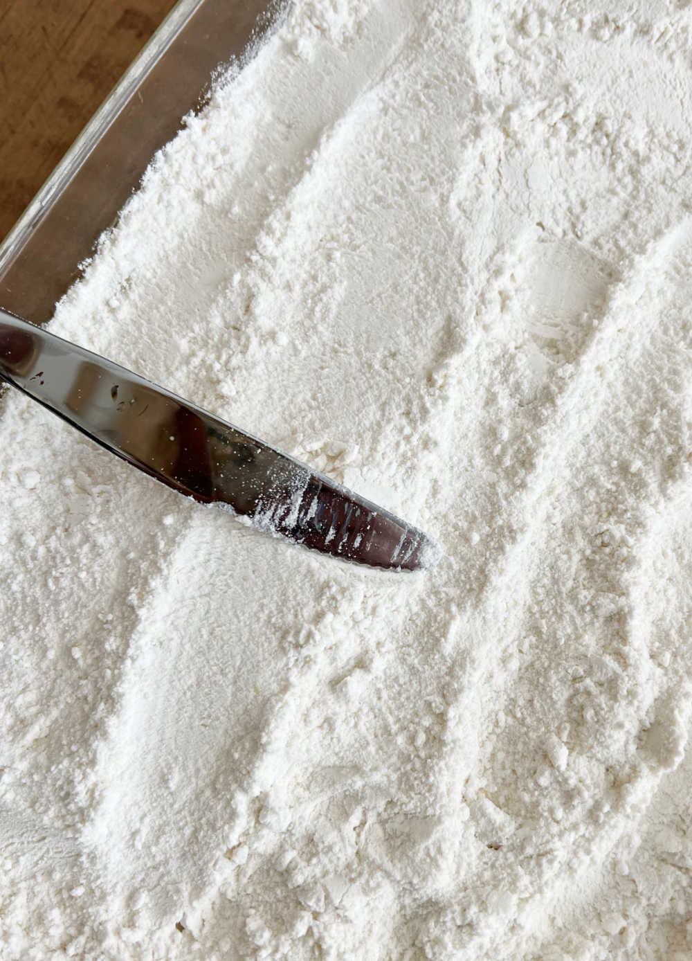 smooth cake mix over pie filling in baking dish