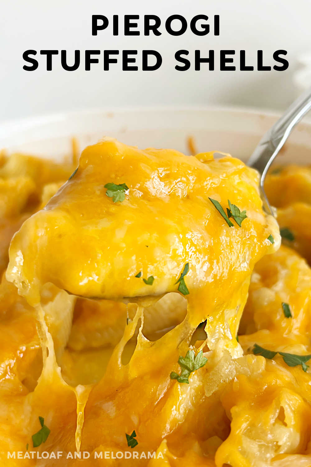 Easy Pierogi Stuffed Shells are baked pasta shells filled with cheesy mashed potatoes topped with sauteed onions and lots of cheddar cheese. This lazy pierogi casserole makes a delicious dinner the whole family will love! via @meamel