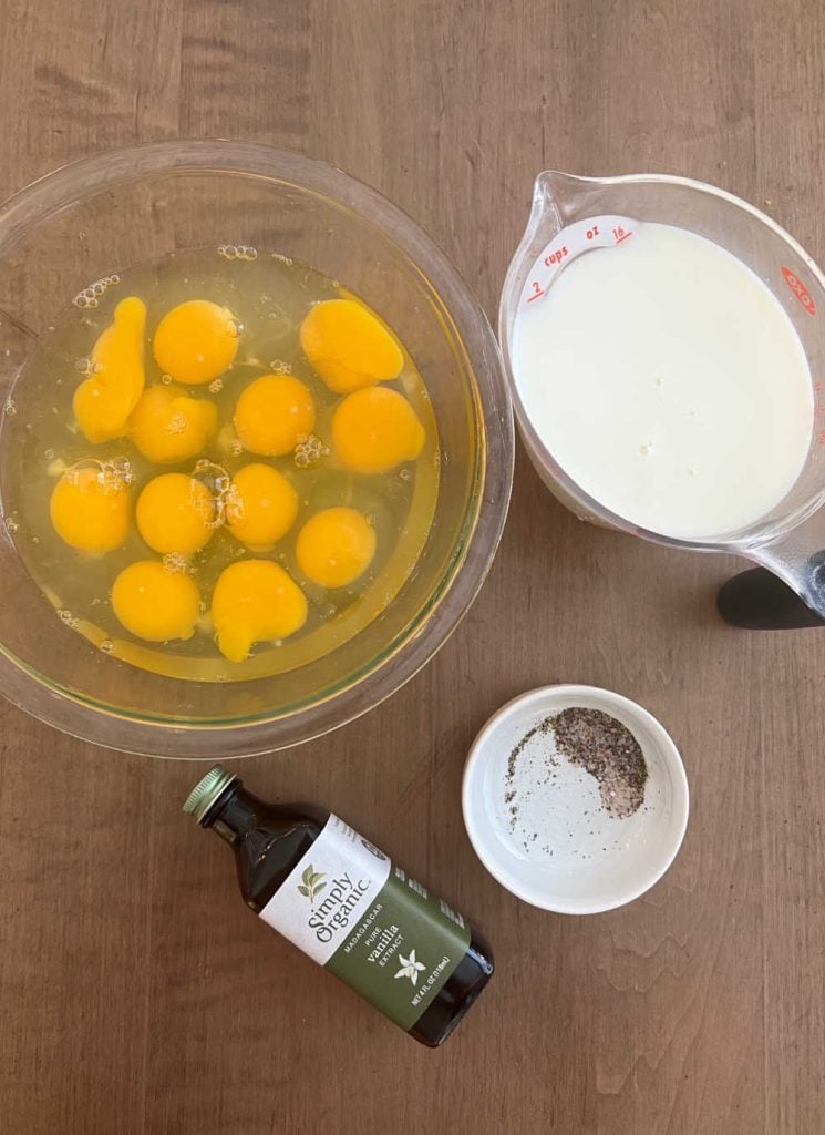 eggs, milk, vanilla and seasonings on the table