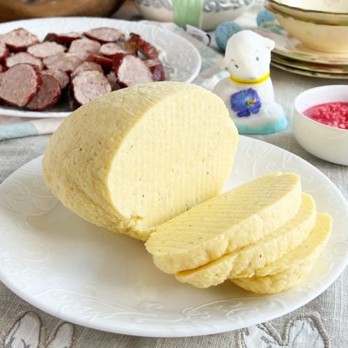 Slovak Easter cheese (cirak or hrudka) on the table with kolbassa and beet horseradish