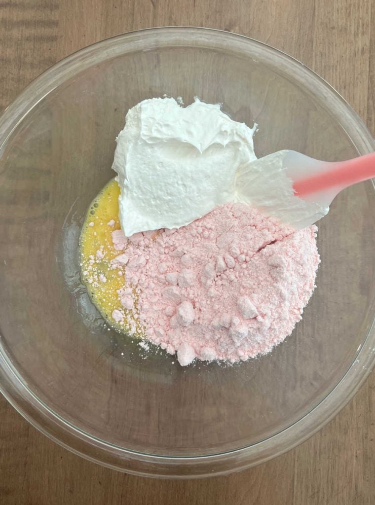 strawberry cake mix, cool whip and egg in mixing bowl