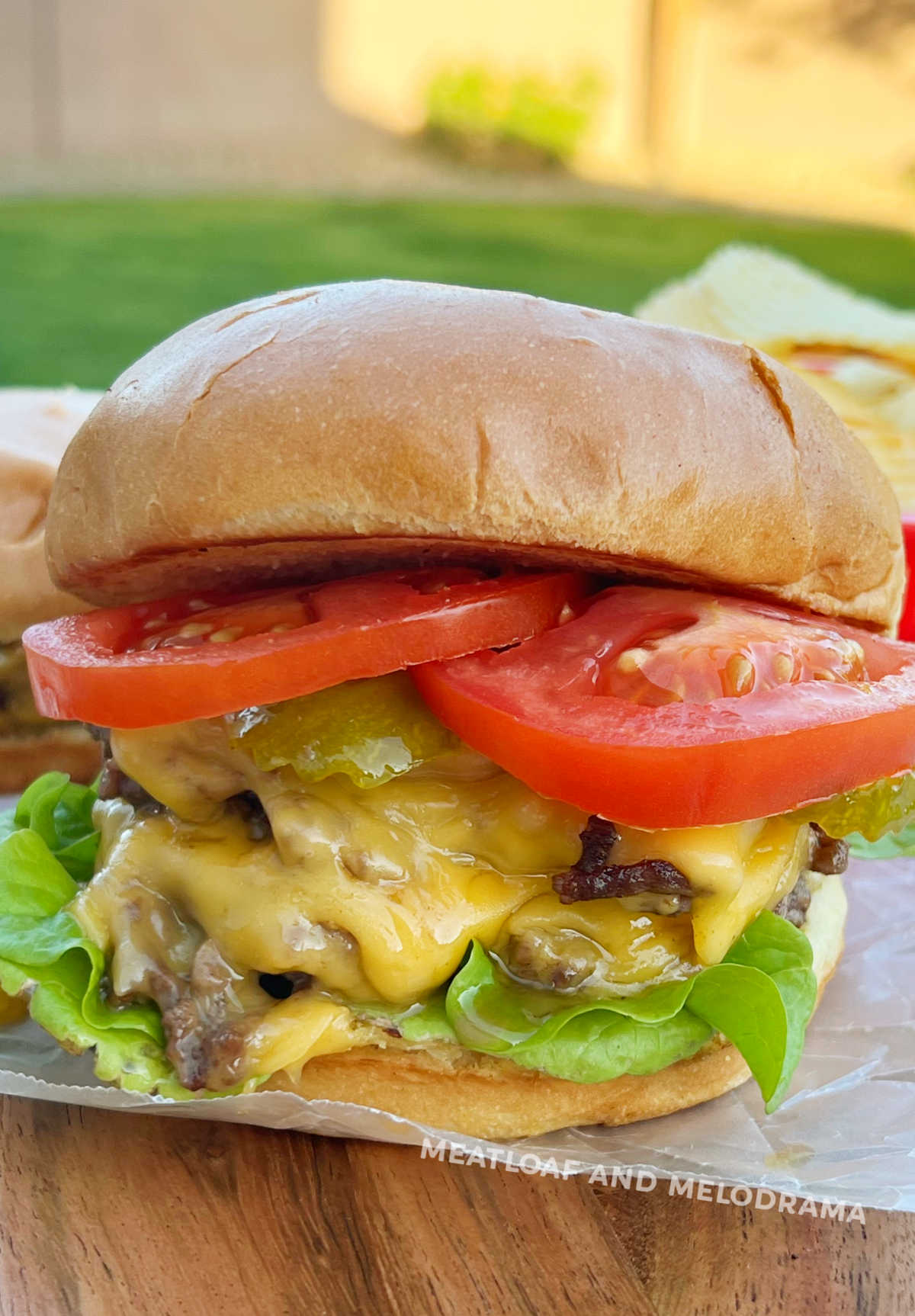 The Ultimate Cheddar Burger! Double cheddar cheese, tomato, red onion, &  spring mix with housemade roasted garlic aioli on a brioche…