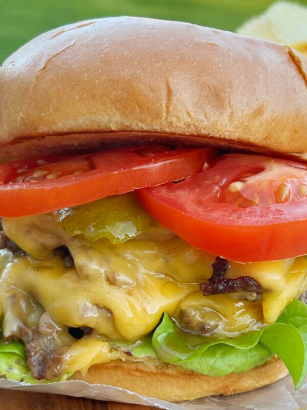 blackstone smash burger with double cheeseburgers, lettuce and tomato on brioche bun
