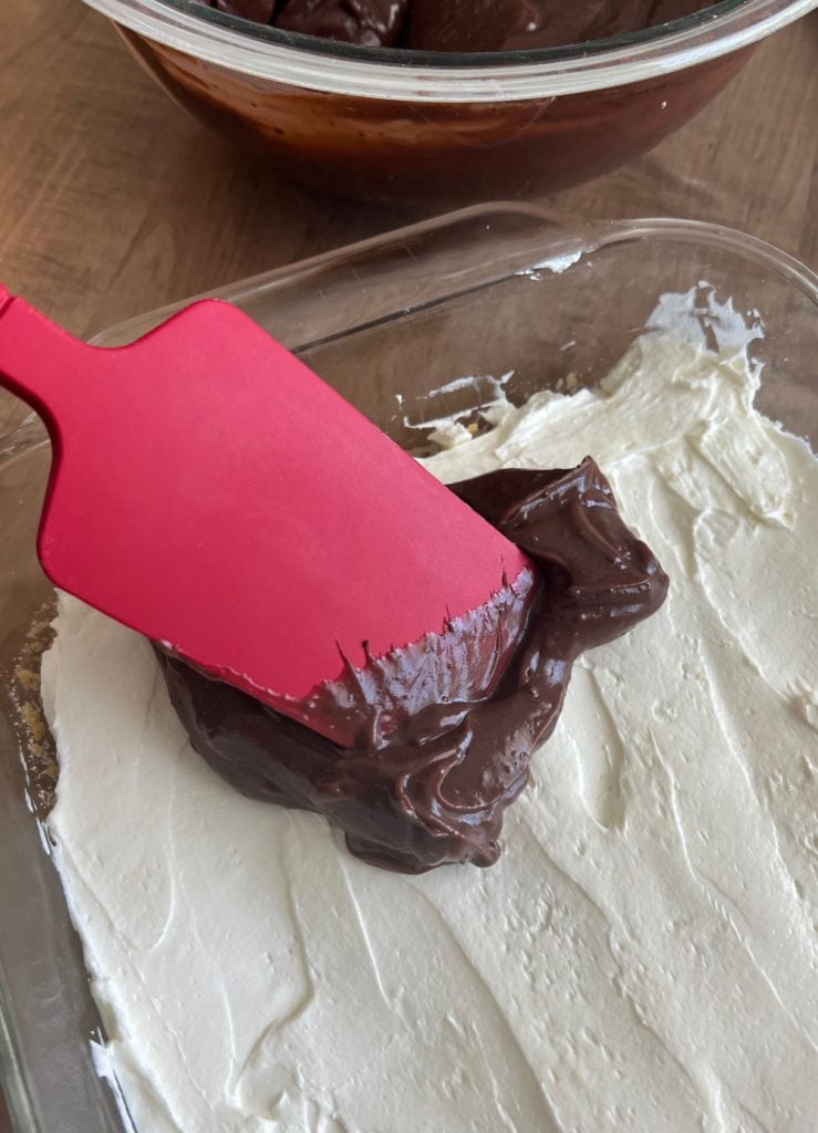 spread instant pudding on cream cheese layer in pan