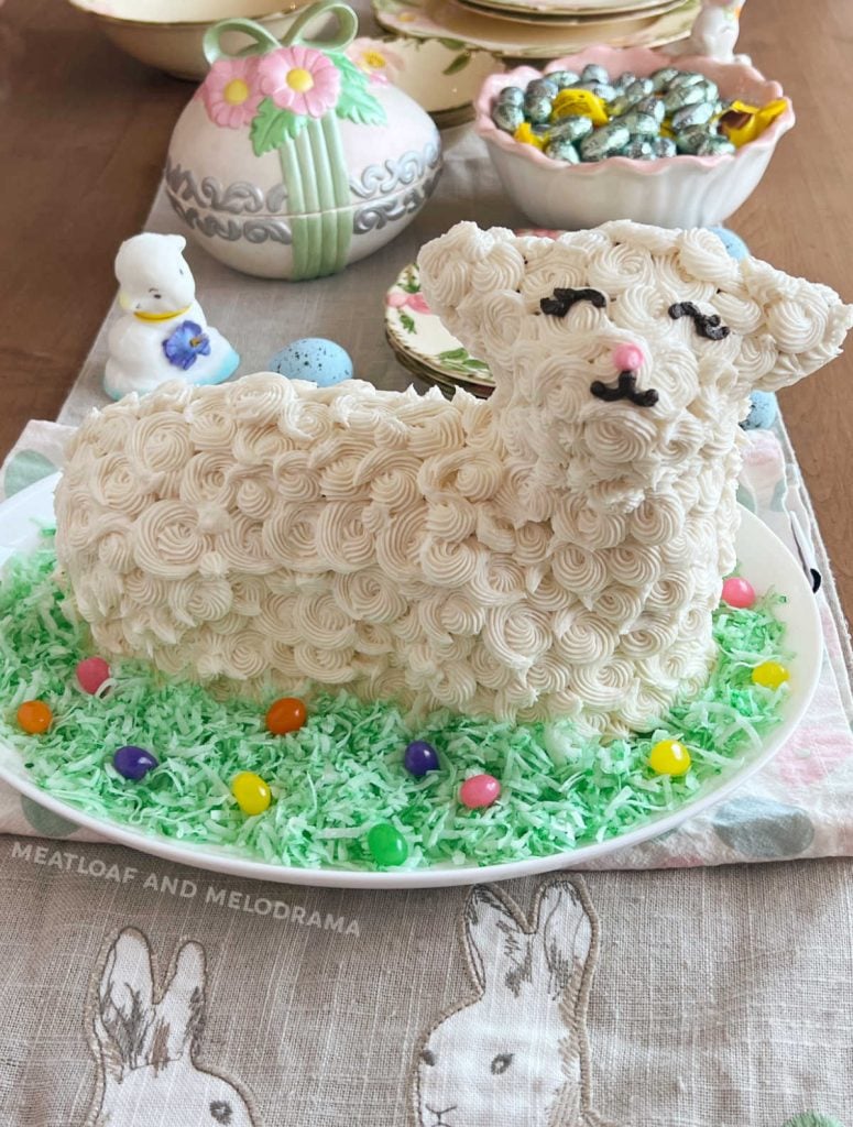easter lamb cake decorated with buttercream frosting and jelly beans on the table