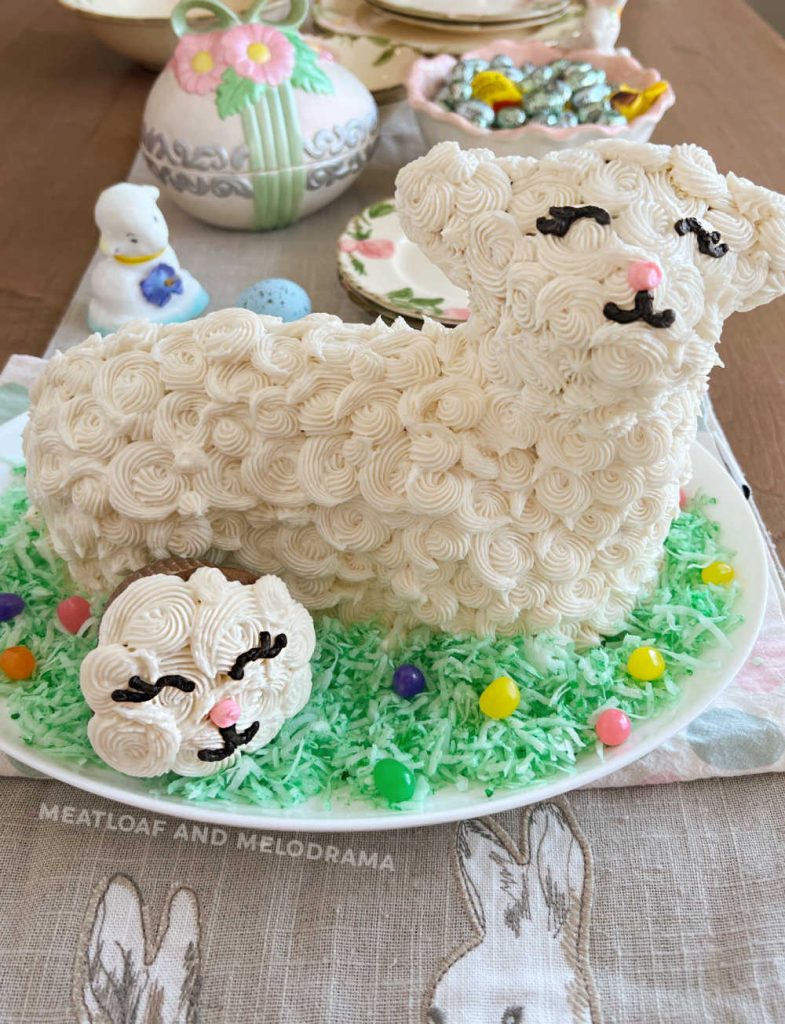 decorated lamb cake with lamb cupcake and jelly beans on Easter table