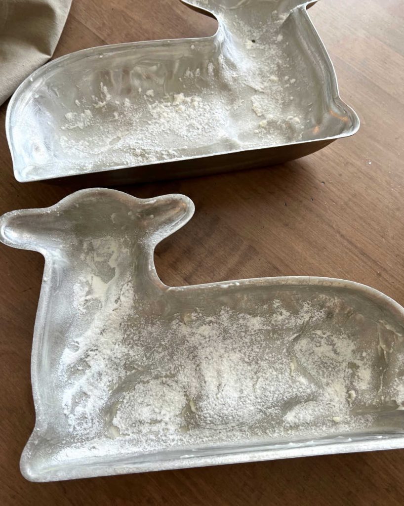lamb cake mold greased and floured on table