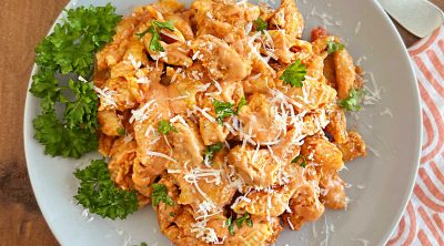 instant pot chicken pasta in creamy sauce with parmesan cheese on a plate