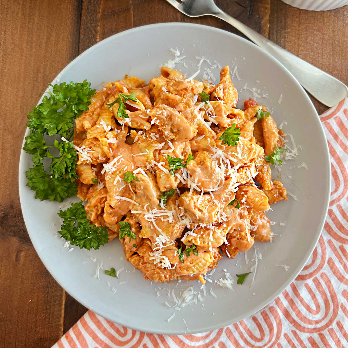 instant pot chicken pasta in creamy sauce with parmesan cheese on a plate