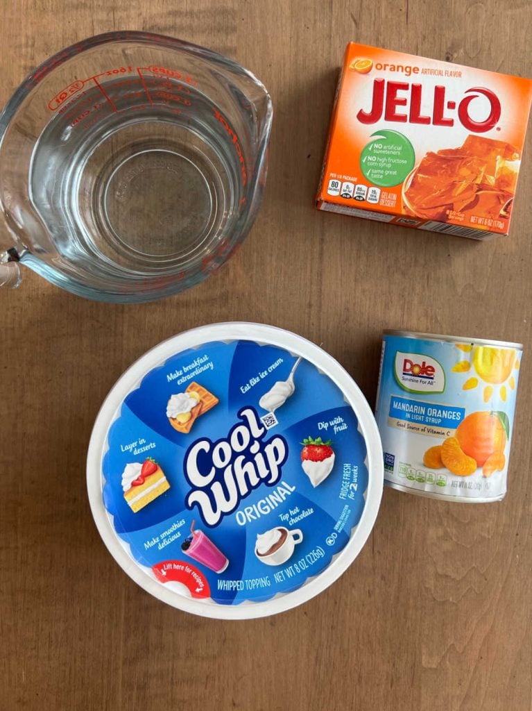 cool whip and orange jello and mandarin oranges and water