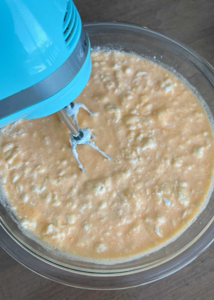 mix cool whip with jello with electric mixer in mixing bowl