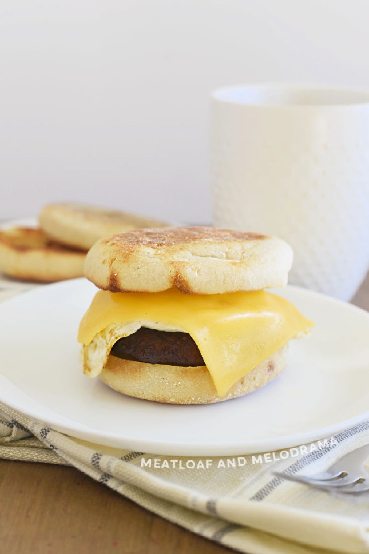 egg breakfast sandwich recipe with sausage and cheese on english muffin
