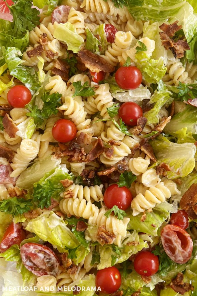 close up of cold pasta salad with rotini, bacon, lettuce and tomatoes