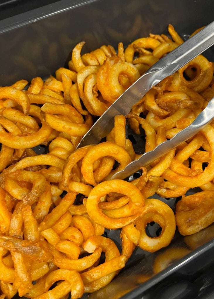 turn frozen curly fries in air fryer during cooking process