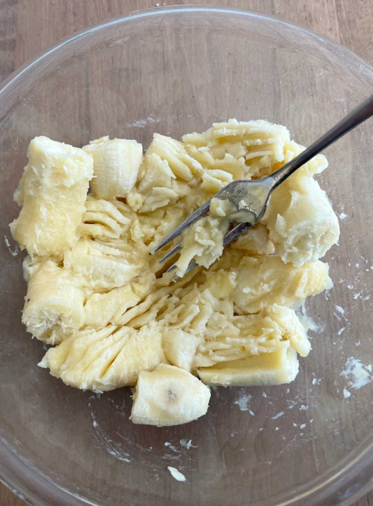 mash bananas in mixing bowl with fork