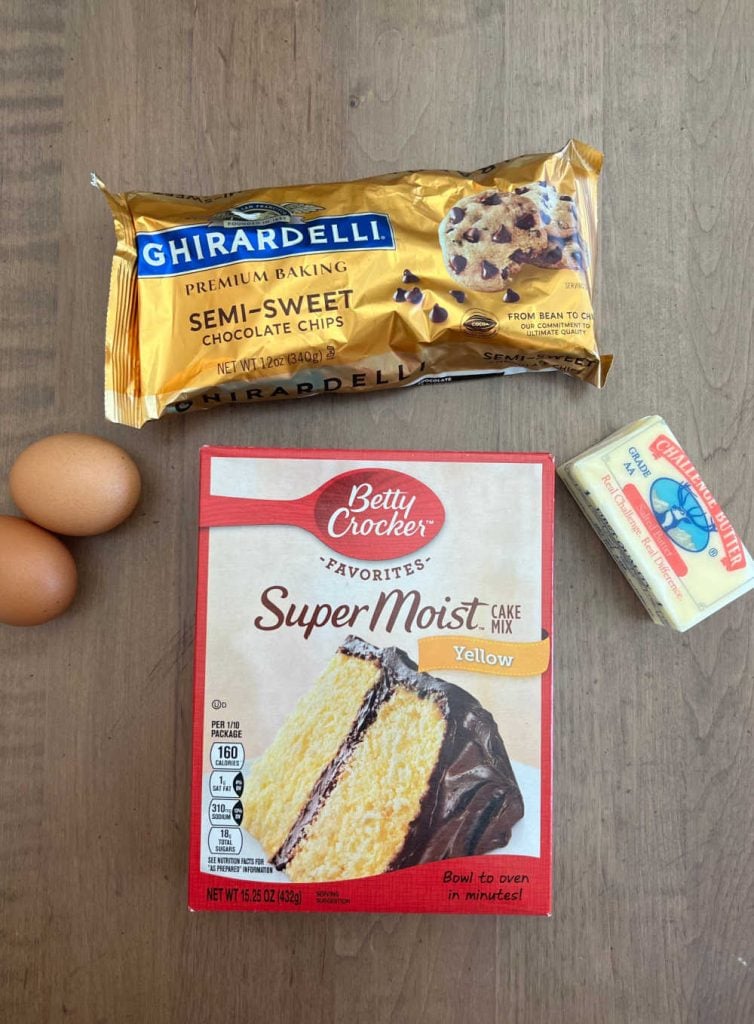 box of yellow cake mix, eggs, chocolate chips and butter