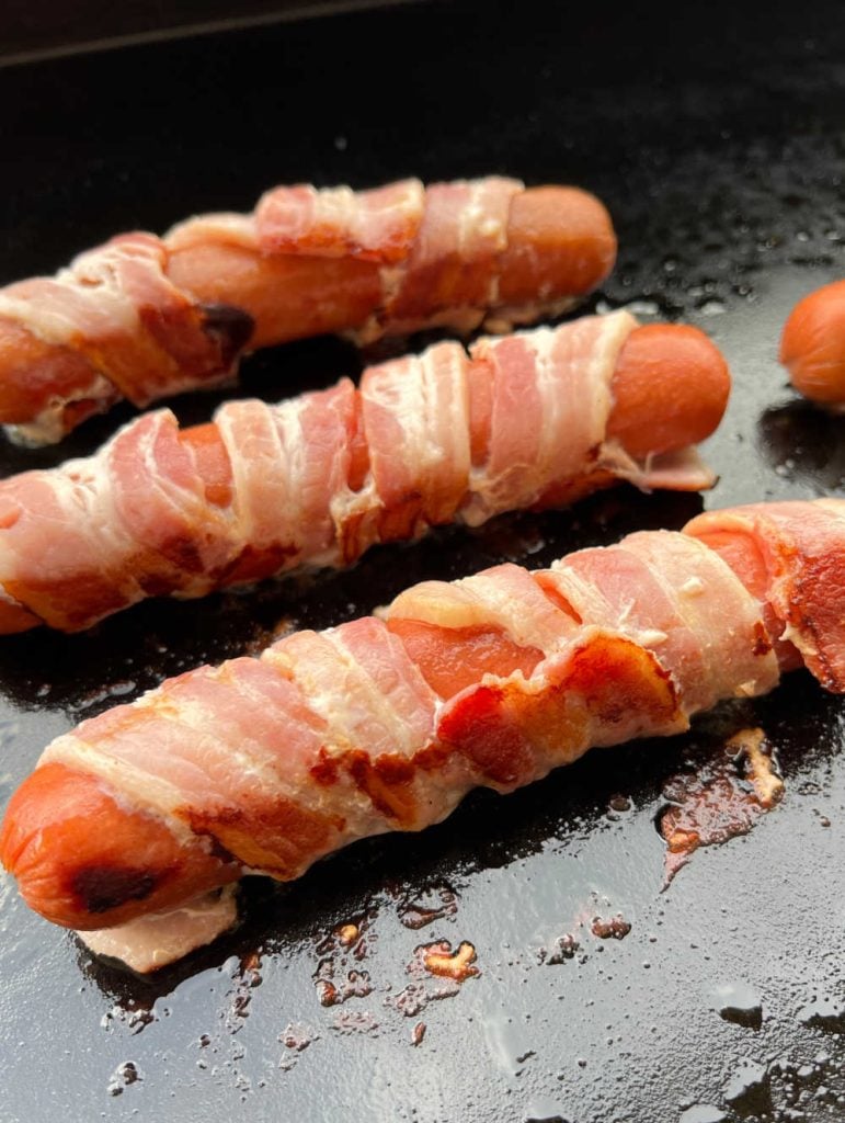 bacon wrapped hot dogs on blackstone griddle