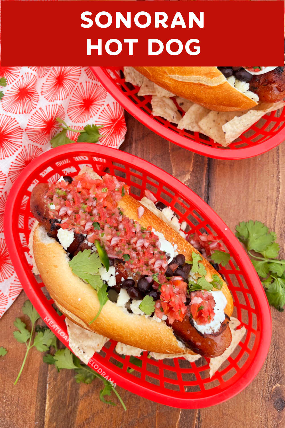 This delicious Sonoran Hot Dog Recipe is basically Mexican hot dogs wrapped in bacon and topped with black beans, salsa fresca, Cotija cheese and crema on a bolillo roll. Enjoy a taste of the Southwest and make Sonoran hot dogs for your next cook out! via @meamel