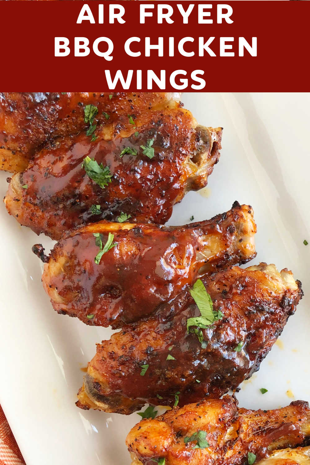 Air Fryer BBQ Chicken Wings seasoned with dry rub and topped with barbecue sauce are delicious crispy wings that are better than deep fried. This easy air fryer chicken wing recipe is perfect for family dinner or a game day appetizer! via @meamel