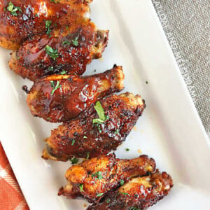 air fryer bbq chicken wings with barbecue sauce on platter