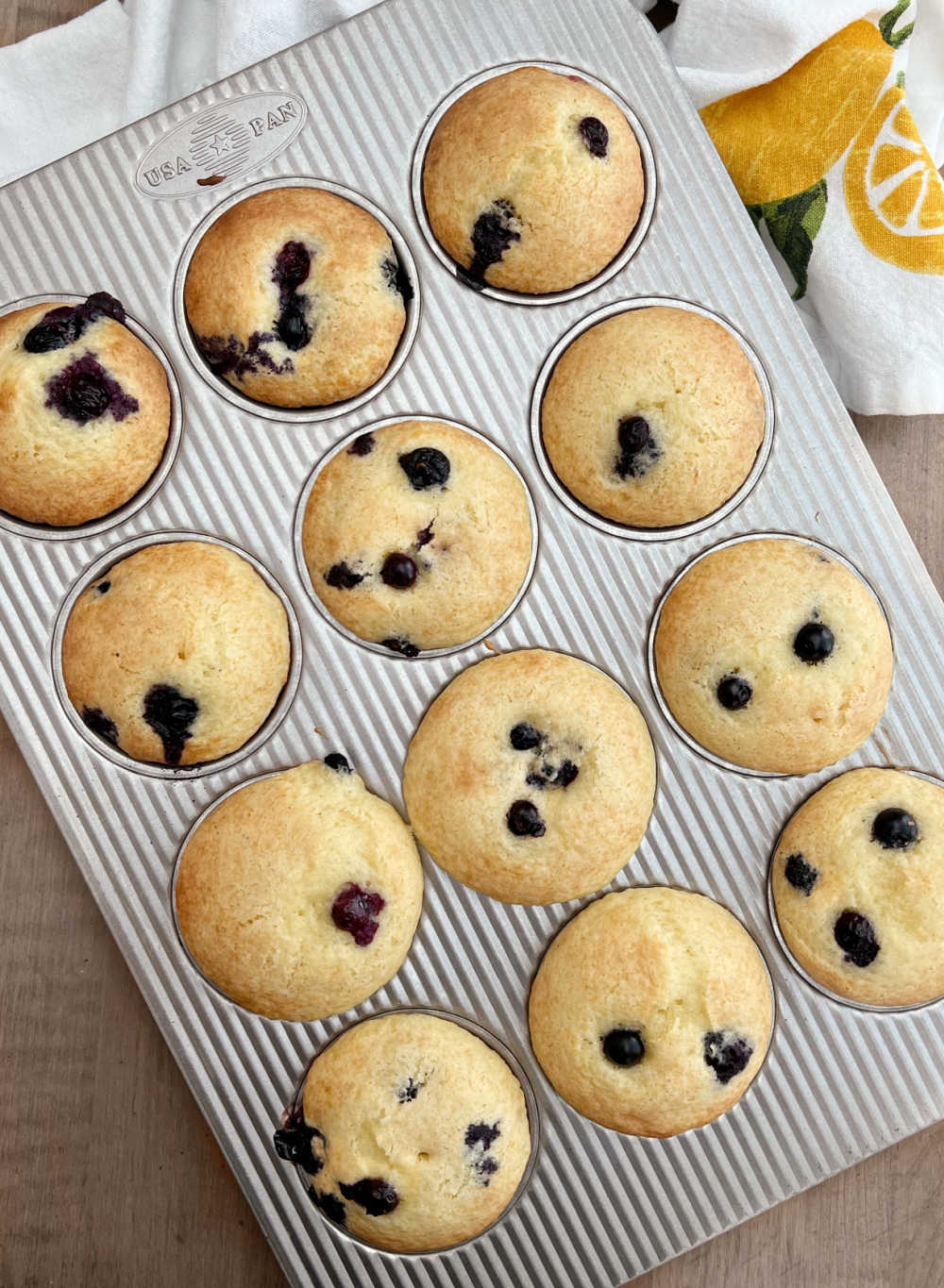 baked blueberry muffins from cake mix in muffin tin