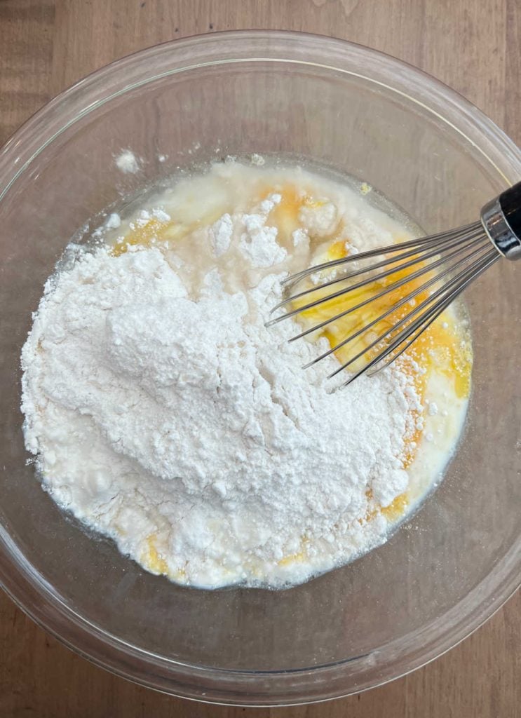 whisk cake mix, eggs, oil and milk in mixing bowl