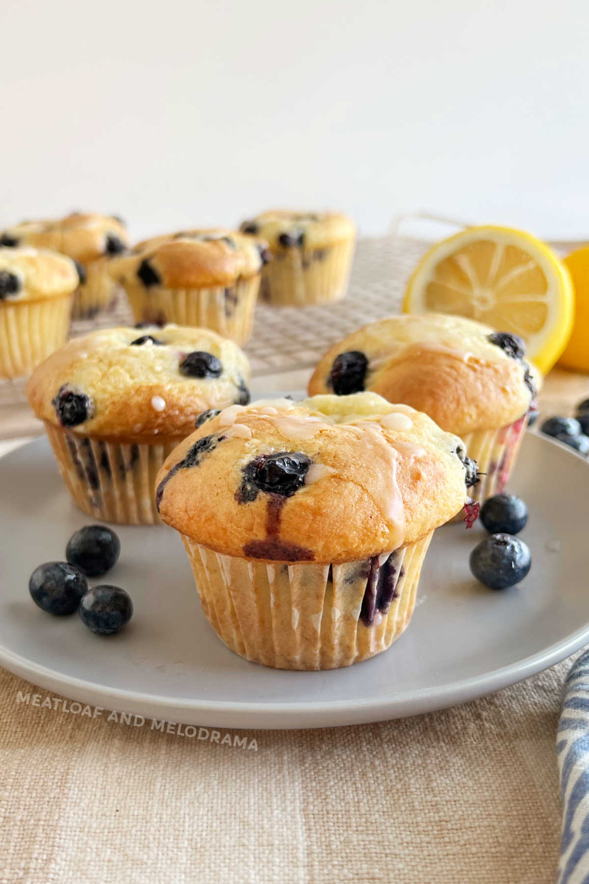 cake mix blueberry muffins with lemon glaze on the table