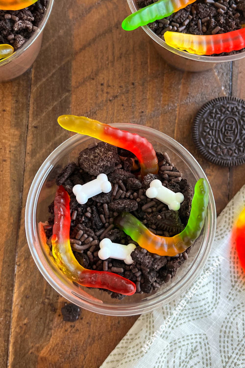 halloween dirt and worms dessert with candy bones