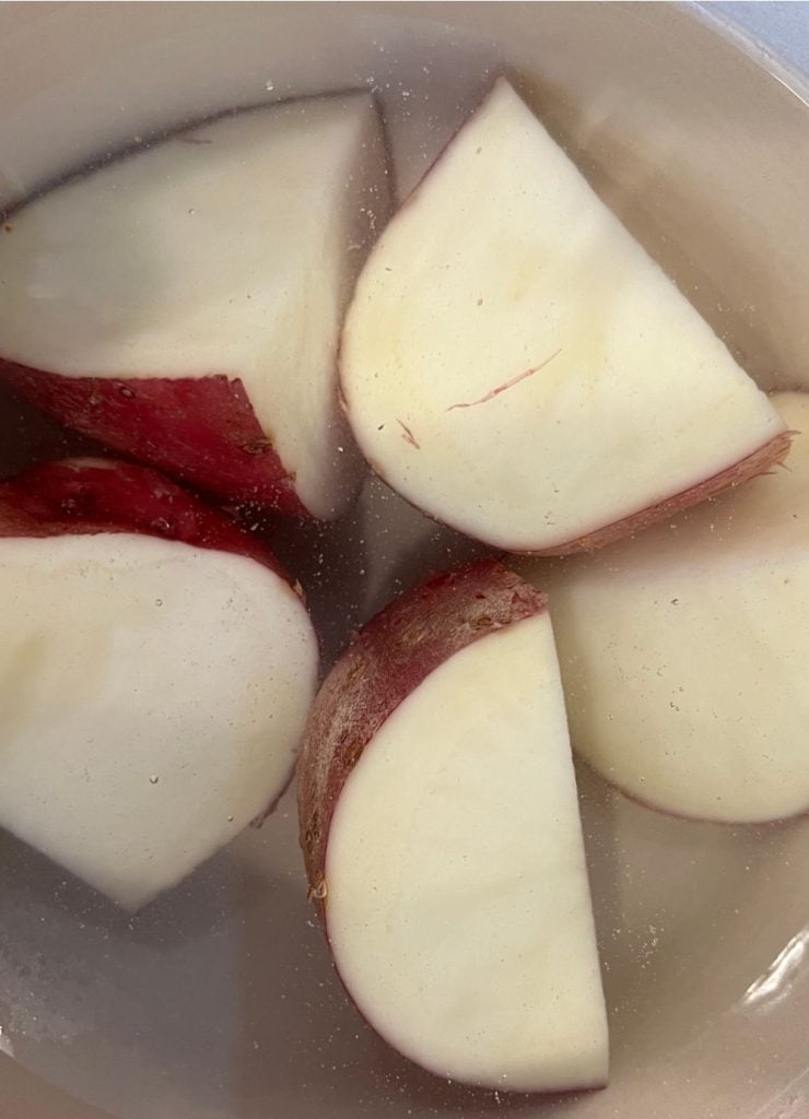 boil red potatoes cut in half in skins