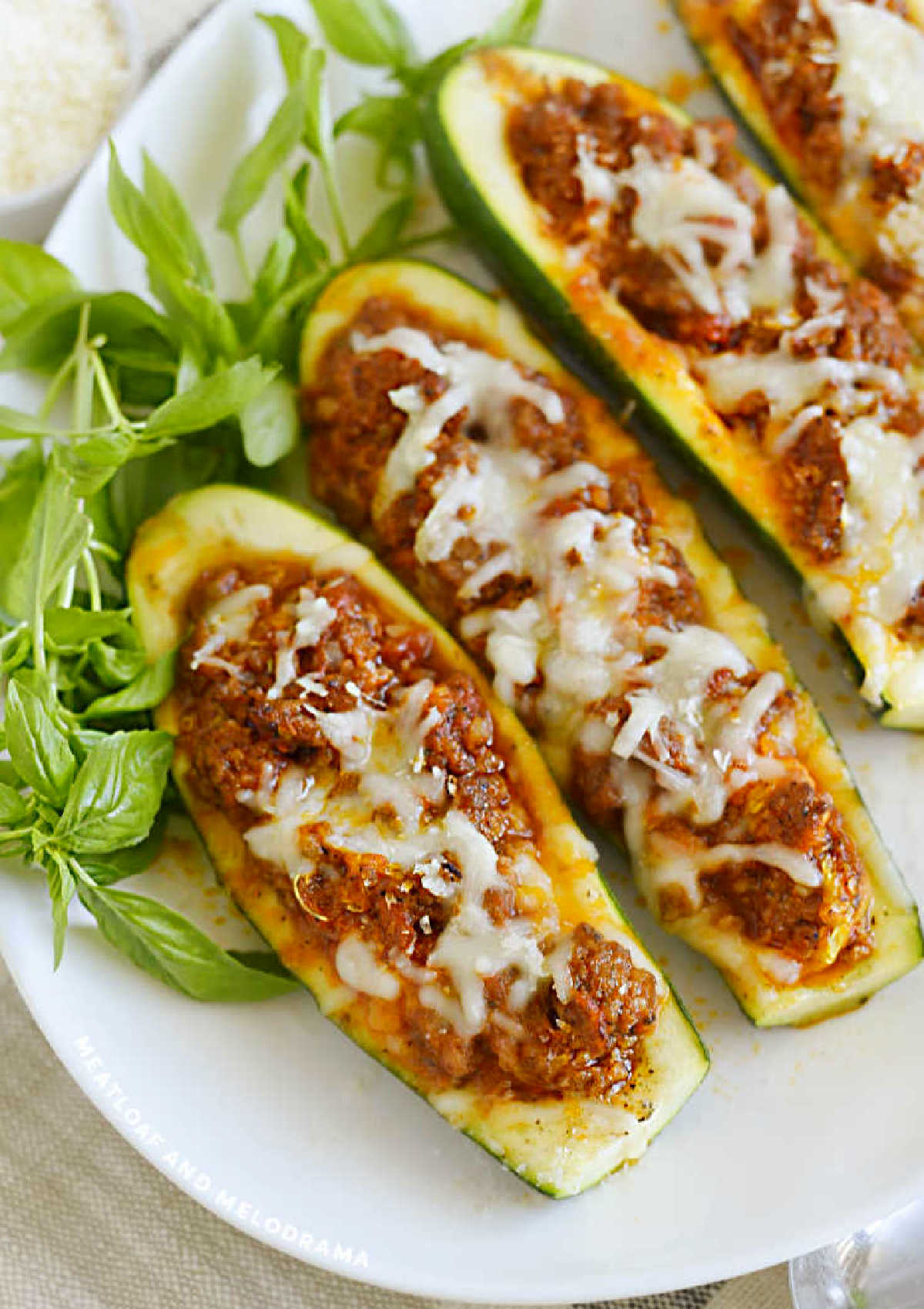 low carb stuffed zucchini boats with italian sausage and melted cheese