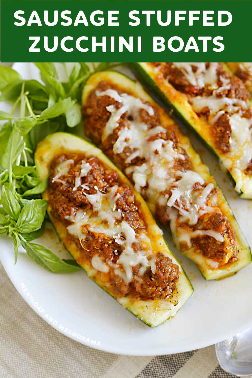 This easy recipe for Sausage Stuffed Zucchini Boats with Italian sausage in a cheesy tomato sauce makes a delicious low carb dinner the whole family will love! via @meamel