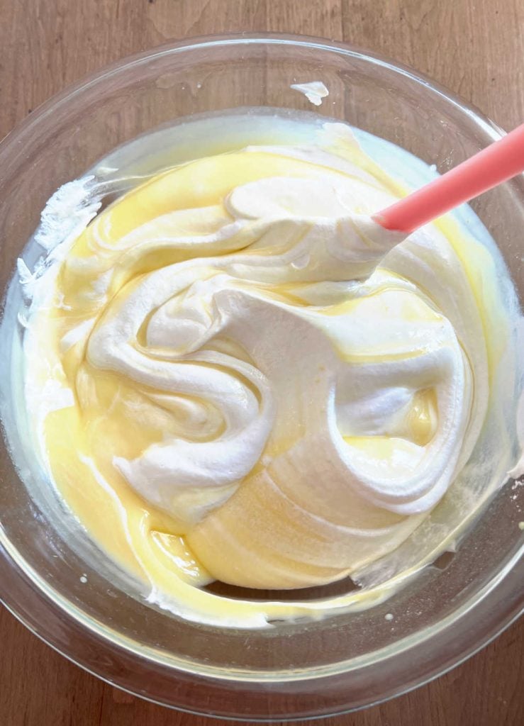 mix instant vanilla pudding with cool whip in mixing bowl