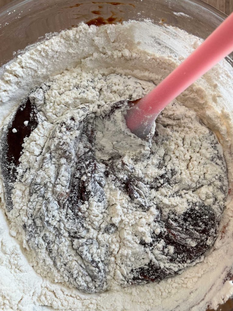 stir flour with melted chocolate mixture in mixing bowl