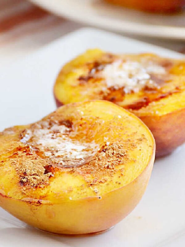 baked peaches with brown sugar and cinnamon on a plate