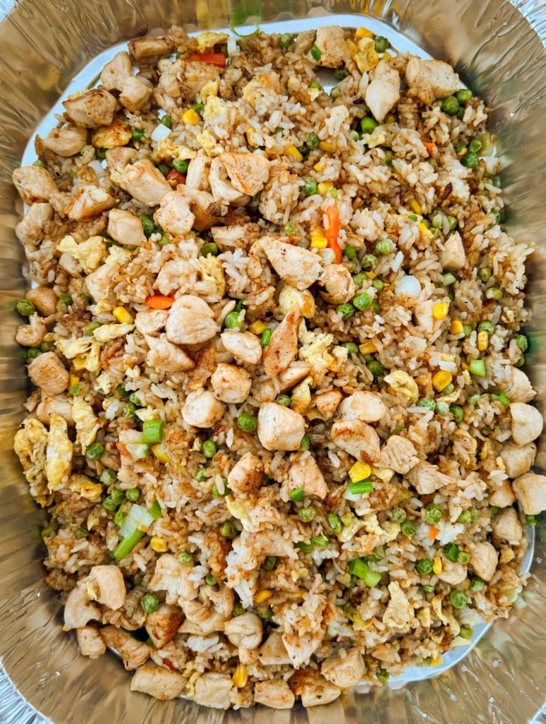 pan of chicken fried rice cooked on blackstone