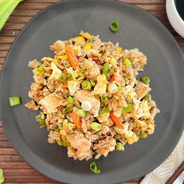 blackstone chicken fried rice with egg and vegetables on a plate