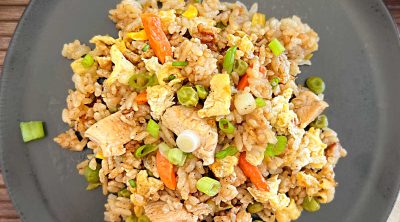 blackstone chicken fried rice with egg and vegetables on a plate
