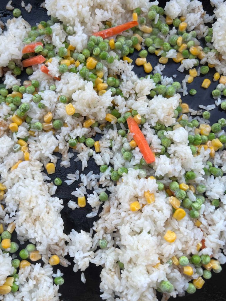 jasmine rice and frozen vegetables on blackstone griddle