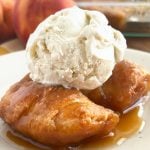 crescent roll peach dumplings with scoop of vanilla ice cream