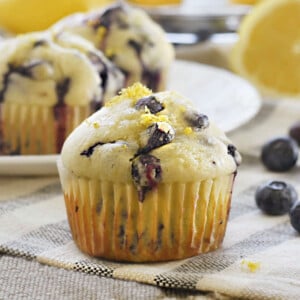 glazed lemon blueberry muffins with fresh blueberries and lemon zest